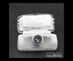 LUCI LED PROIETTORI LOGO Nissan PORTIERE Kit Luci