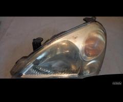 FARO ANTERIORE SX, DX SUZUKI LIANA 2004