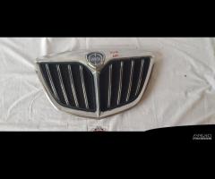 LANCIA MUSA RESTYLING MASCHERINA COFANO 51810093