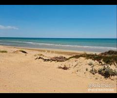 Tre fontane terreno fronte mare "dune di puzzite