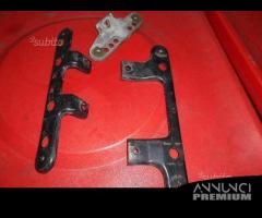 Coppia staffe per pedane Suzuki Burgman 650