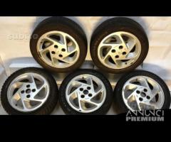 5 cerchi con gomme ford sr da 15 pollici d'epoca