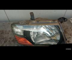 Faro Sx Dx Pajero 2000-2007